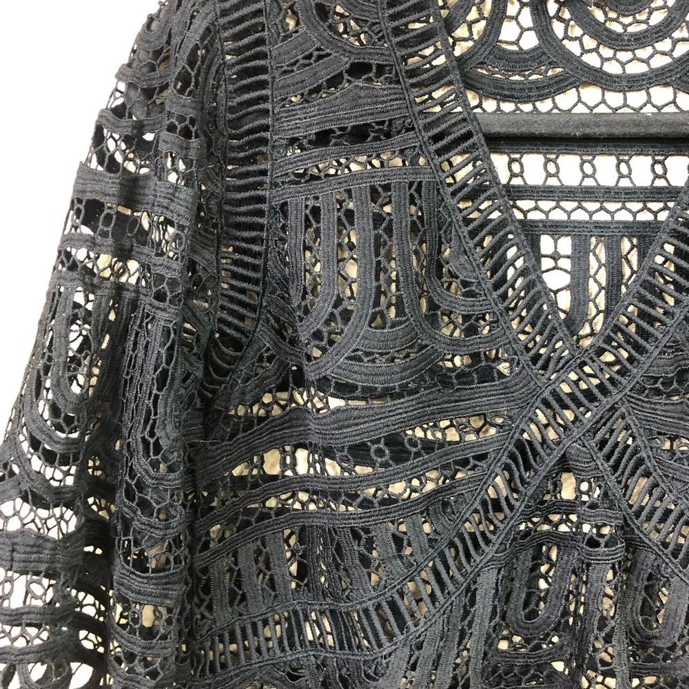 Goldie crocheted lace v neck flare sleeve top.
